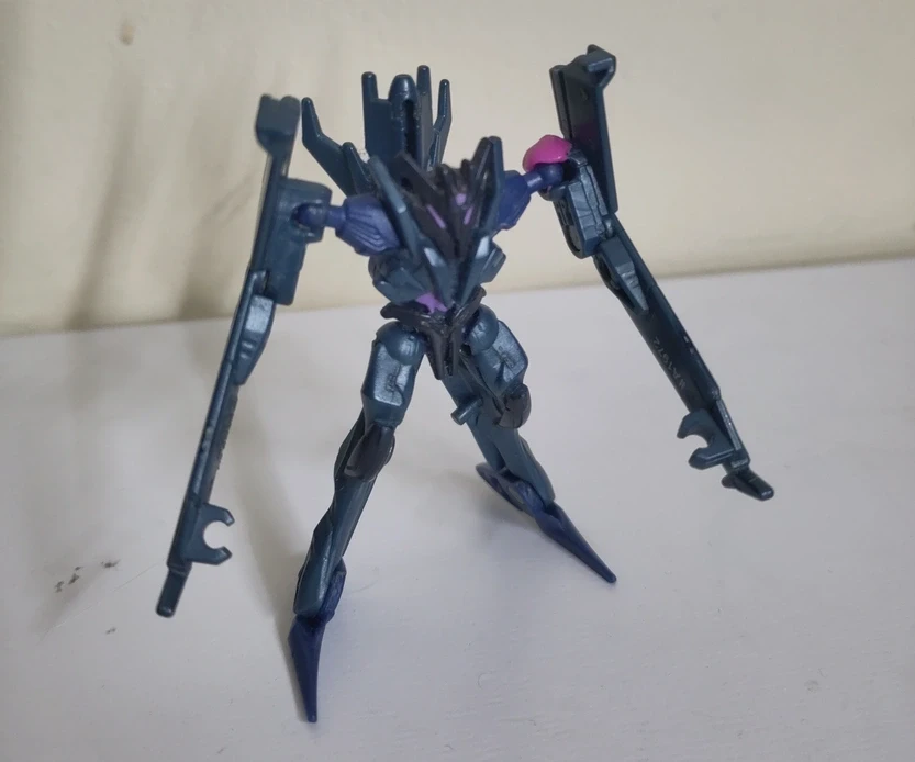 A toy of Soundwave from Transformers Prime with a conspicuous pink lump on its shoulder holding the joint in place.