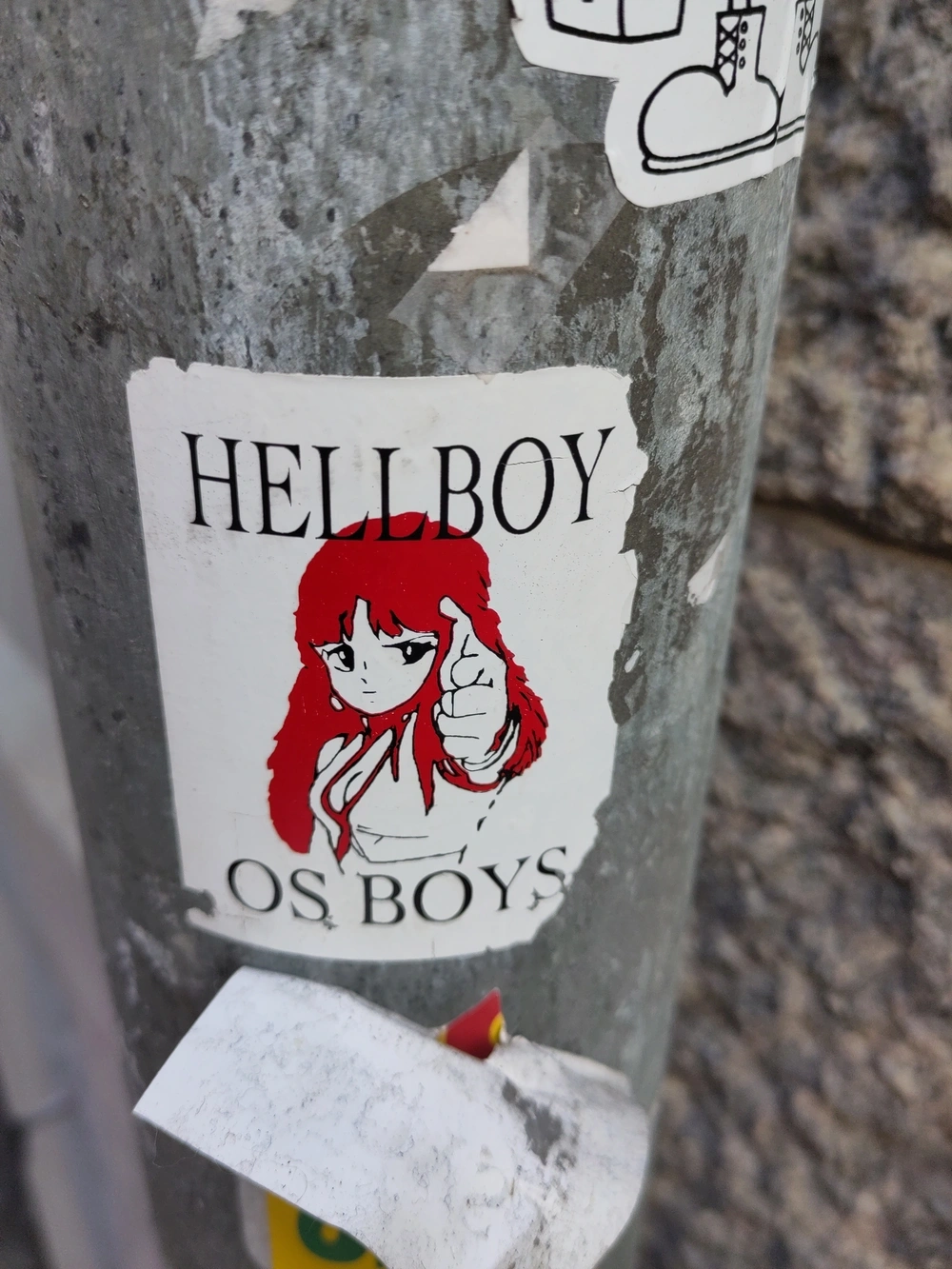 A sticker featuring Yuri from Dirty Pair with text reading “HELLBOY OS BOYS”