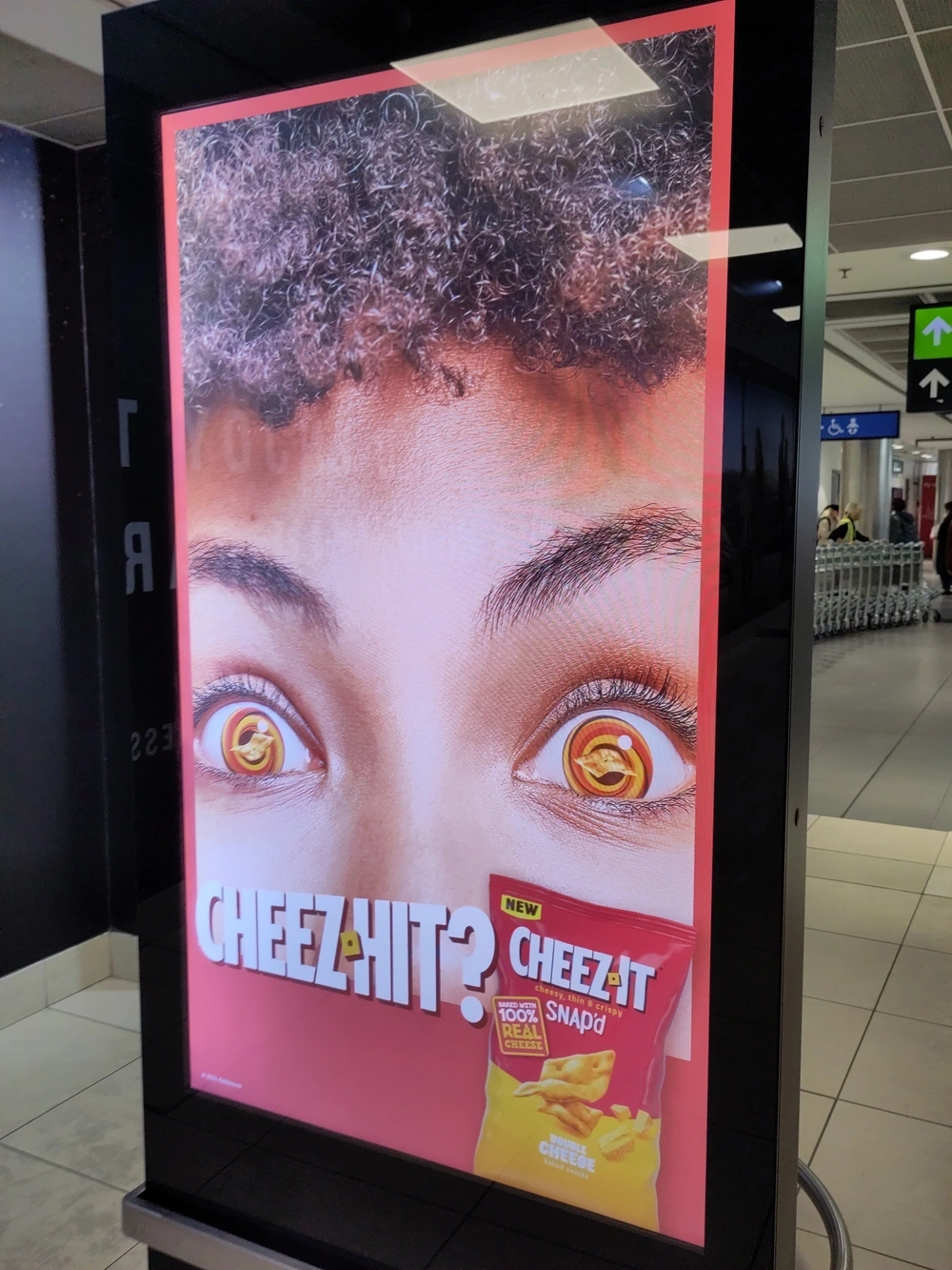 An ad for Cheez-It showing eyes with a spiral pattern and Cheez-Its for pupils.