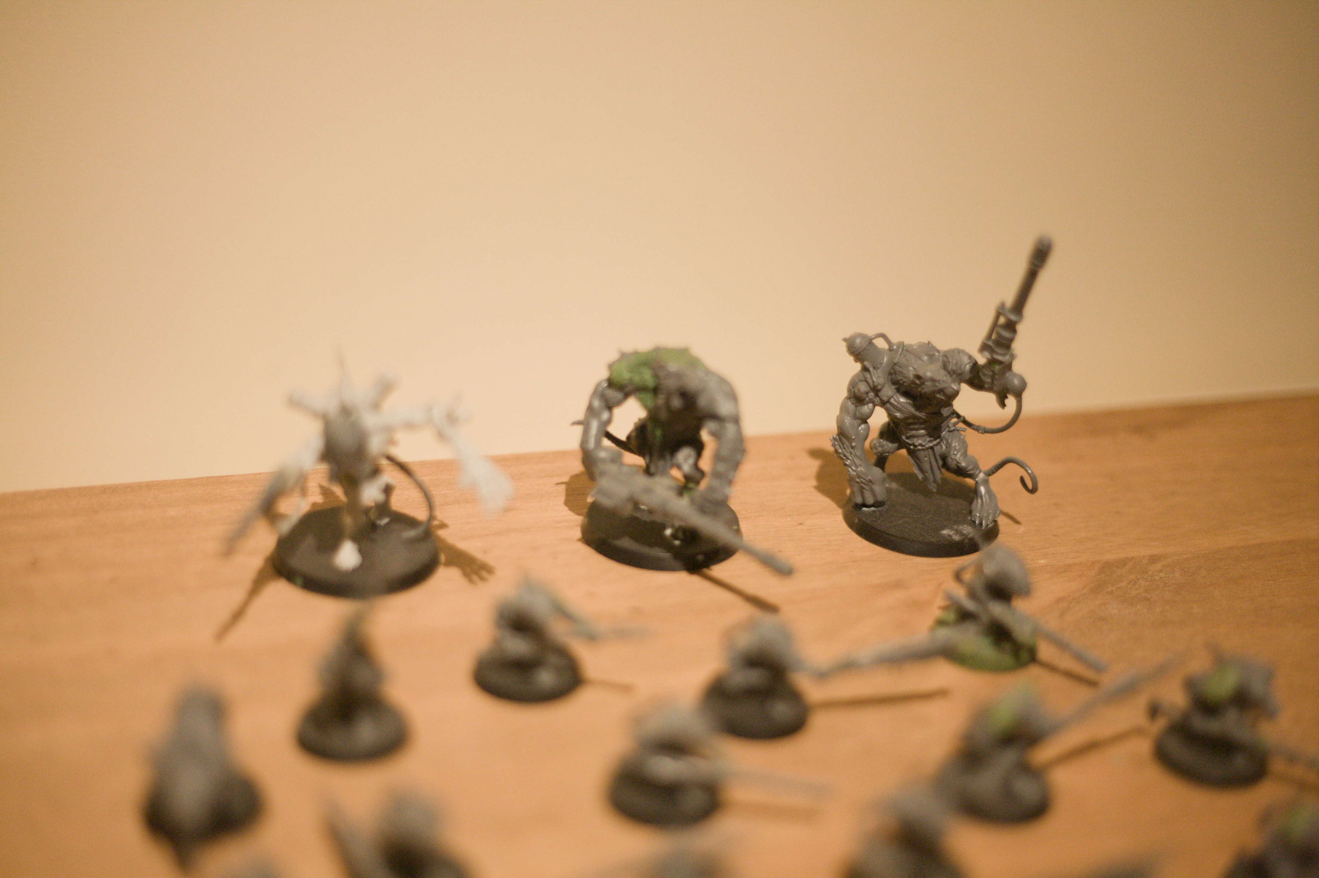 A close up of the giant rat men with the far one in focus.