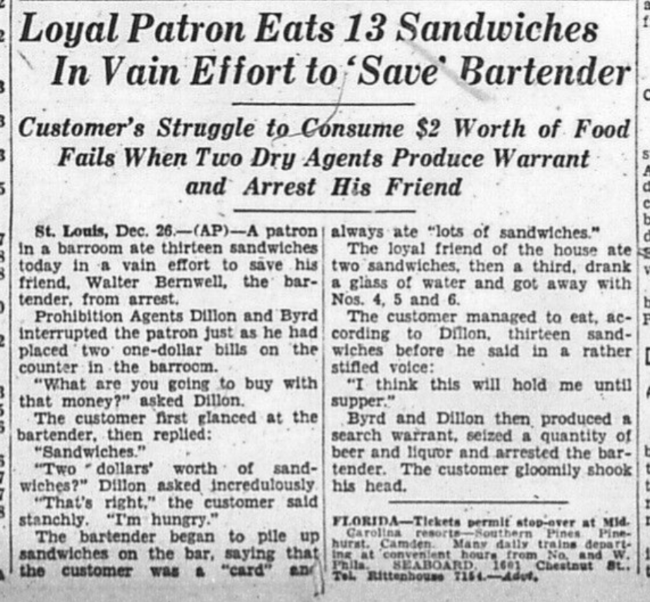 Scan of a newspaper with headline: “Loyal Patron Eats 13 Sandwiches In Vain Effort to ‘Save’ Bartender — Customer’s Struggle to Consume $2 Worth of Food Fails When Two Dry Agents Produce Warrant and Arrest His Friend”